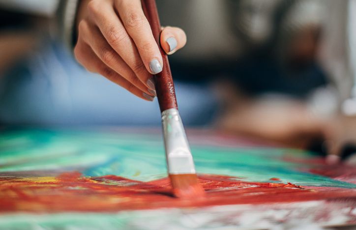Close Up Of A Woman Painting