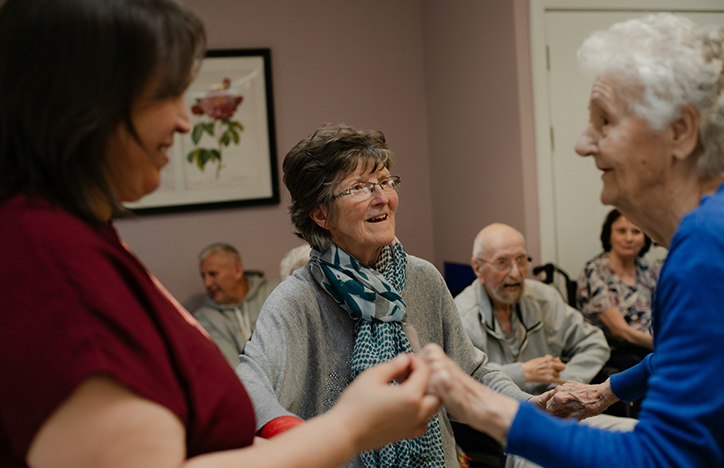 Three Elderly Ladies Laughing Together