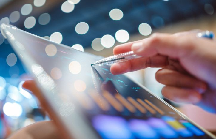 Reviewing Financial Data On A Tablet