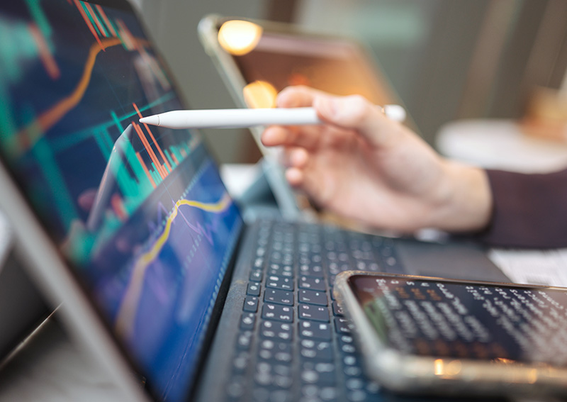 Looking At Financial Graphs On A Screen