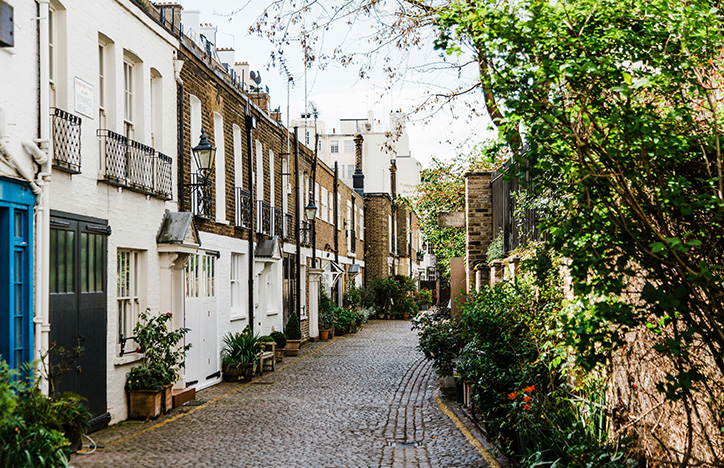 A road surrounded by British-style houses.jpg