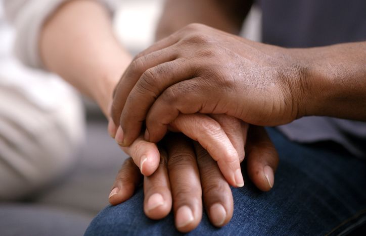 Holding Hands Offering Support
