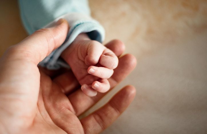 Parent Holding A Baby's Hand