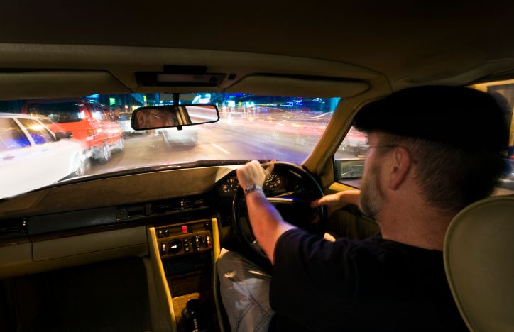 Man Driving A Car Late At Night
