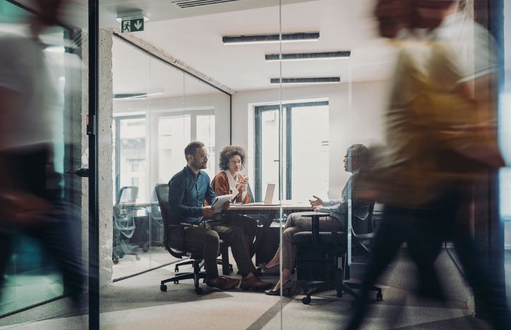 Three People Meeting In An Office