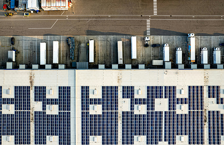 Commercial Trucks Exiting A Depo From An Aerial View