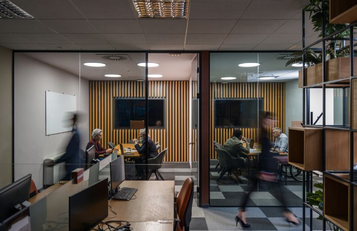 Blurred People Moving Through An Office