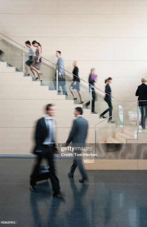 Blurred Professionals On Stairs