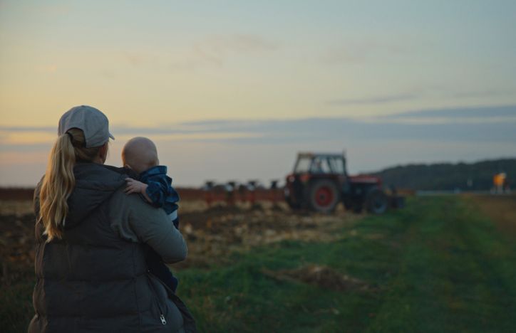 Mother And Baby Overlooking Farm
