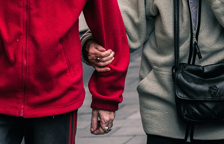 Elderly Couple Linking Arms