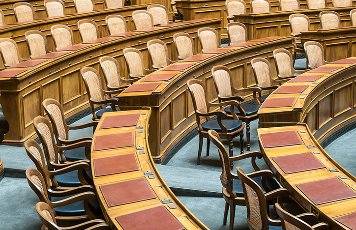Wooden Chairs Arranged In A Council Meeting