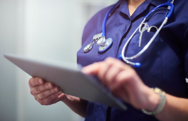 NHS Worker Using A Tablet