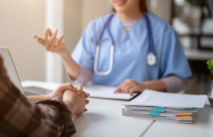 Doctor Speaking With Patient