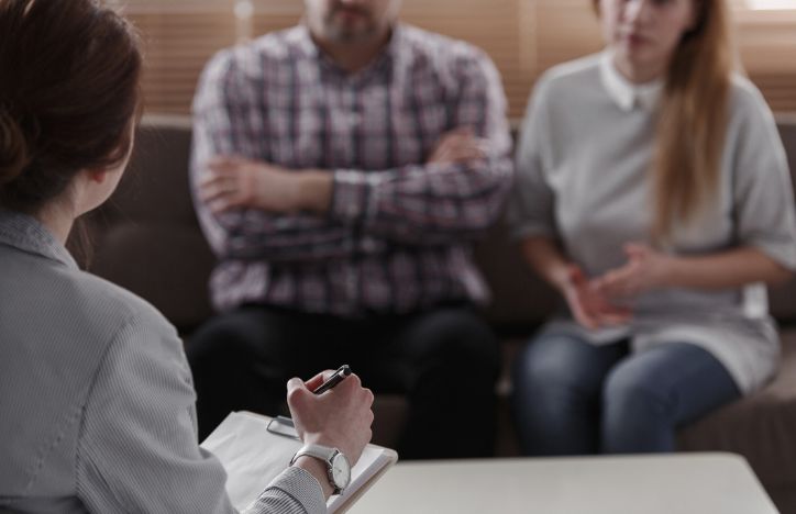 Couple In Discussion With Professional Mediation