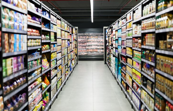 Aisle Of A Supermarket Stacked With Food