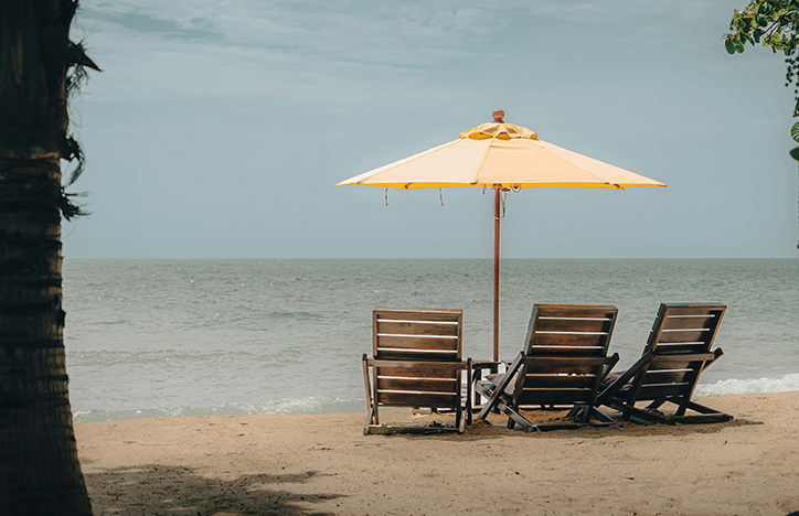 Wooden chairs on the beach.jpg