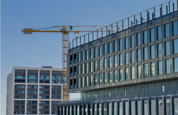 Construction Of New Office Block With A Crane Behind The Building