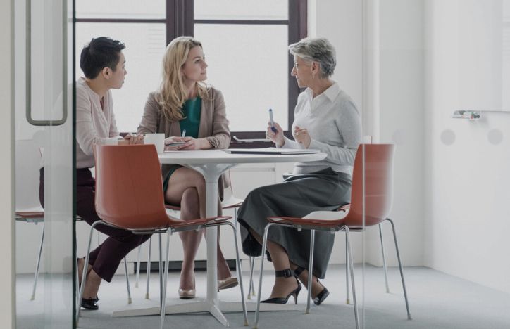 Three People In A Serious Discussion