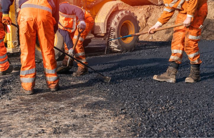 Construction Team Laying New Road