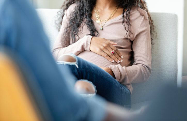 Low Angle View With Focus On Pregnant Woman