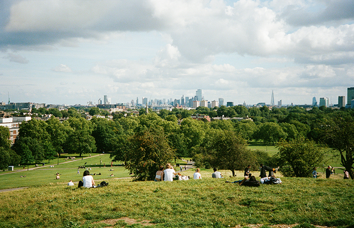People On Hill Overlooking The City
