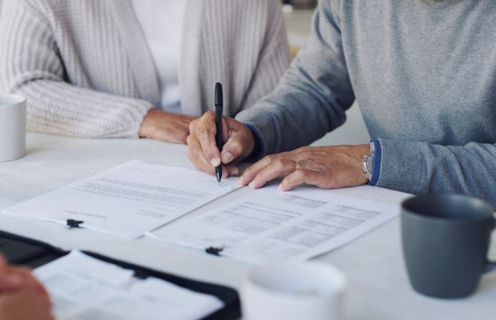 Couple Signing Papers