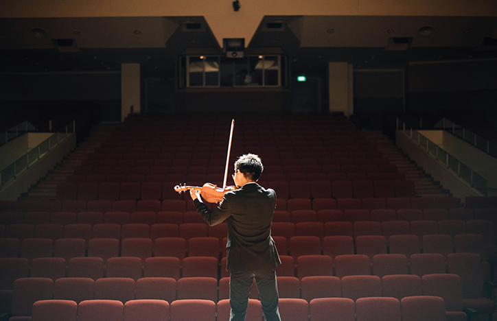 Violinist Playing For An Empty Theatre