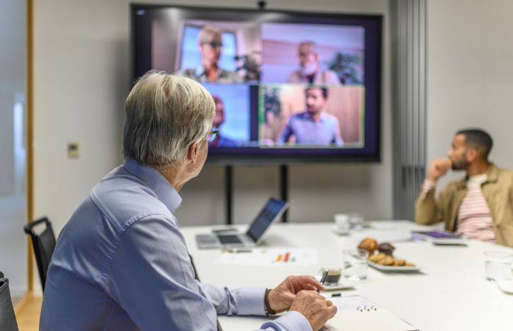Work Video Call With Some People In Office And Others At Home Hybrid Working