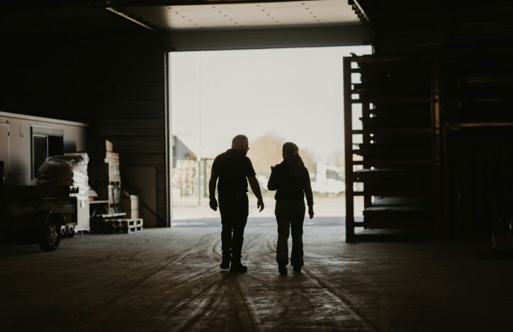 Man and woman walking through warehouse.jpg