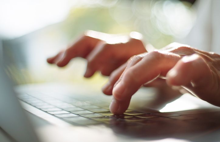 Close Up Of Typing On A Laptop