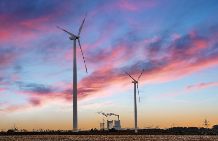 Wind Turbines With Coal Plant In The Background