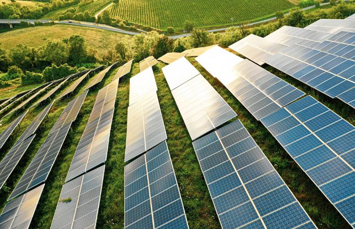 Field Of Solar Panels On A Hill