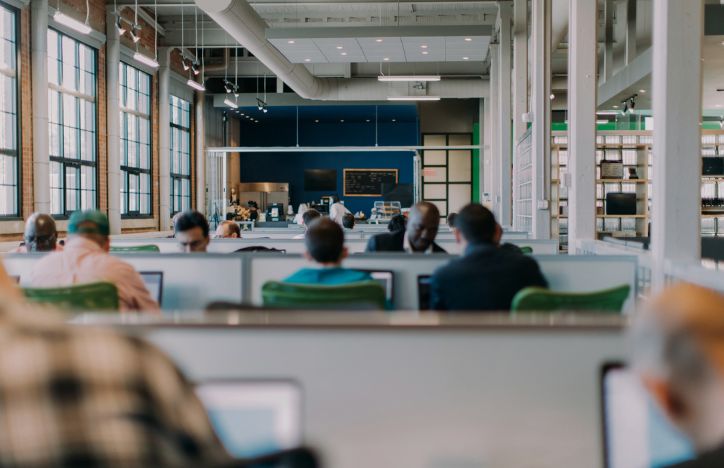 Group Of People Working In An Open Plan Office