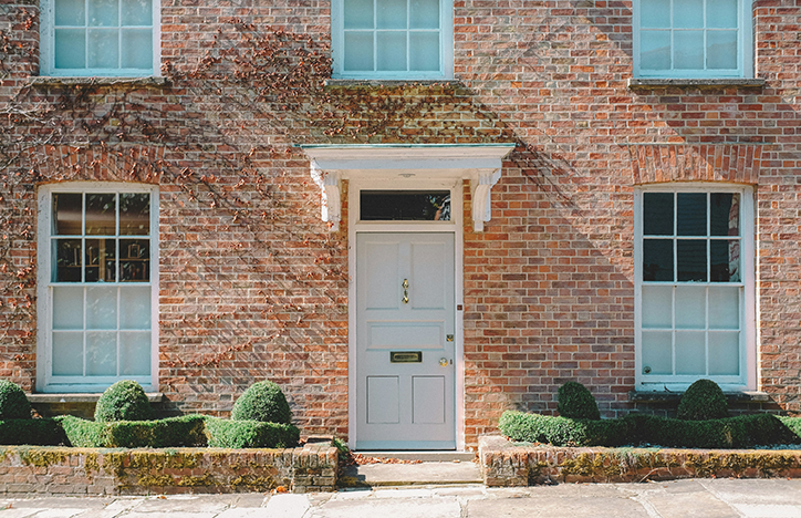 Light Blue Front Door Of A Brick House