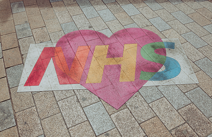 Rainbow NHS Logo On The Sidewalk